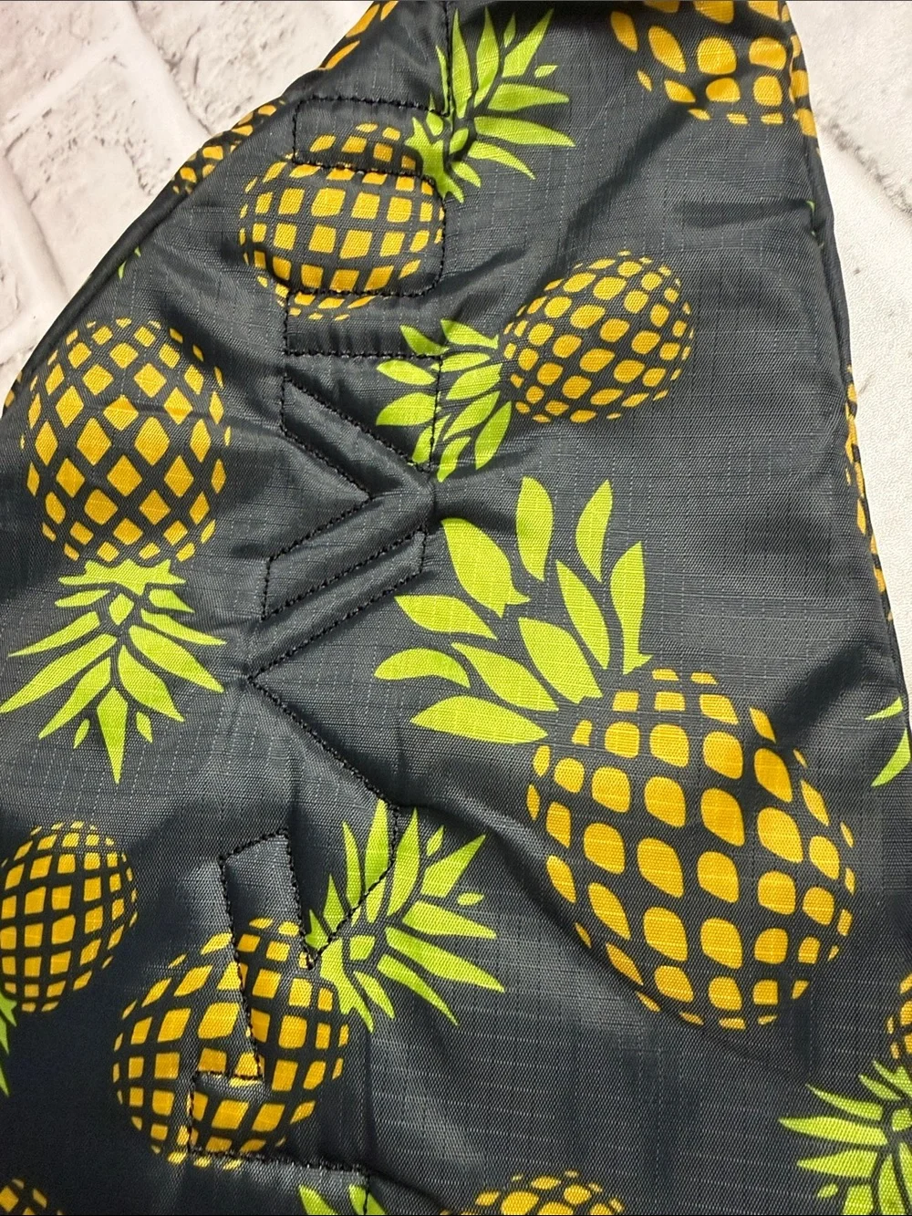 Kavu Black Sling Bag with Yellow Pineapple Print
